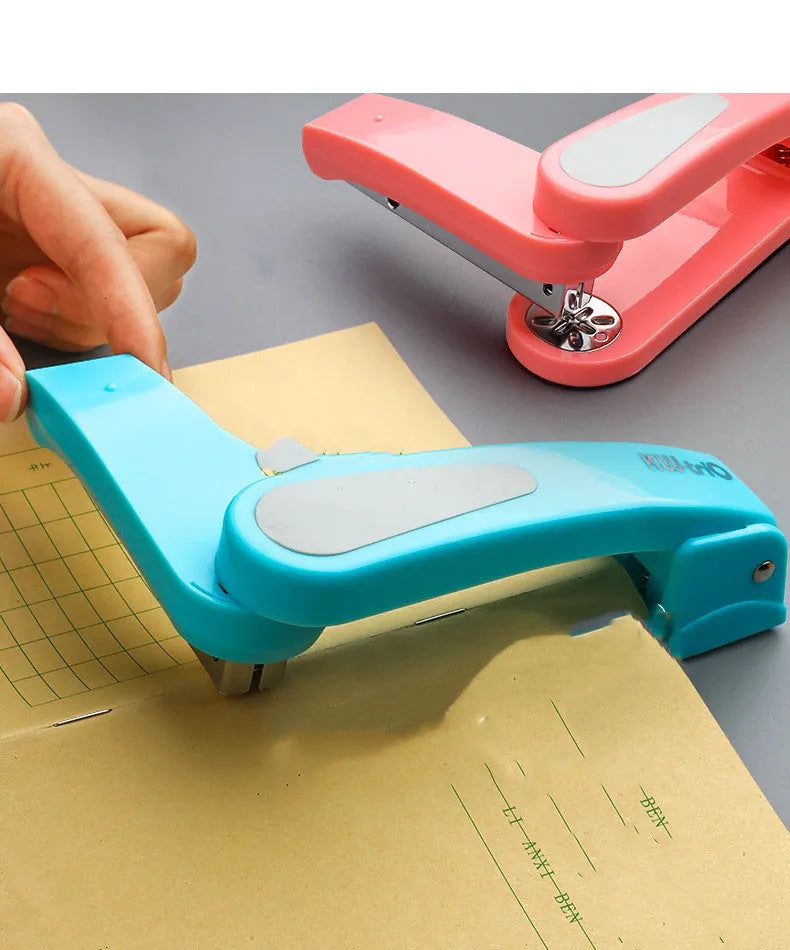 A rotatable student stapler with a 360° spinning head, shown in blue on a desk with papers.