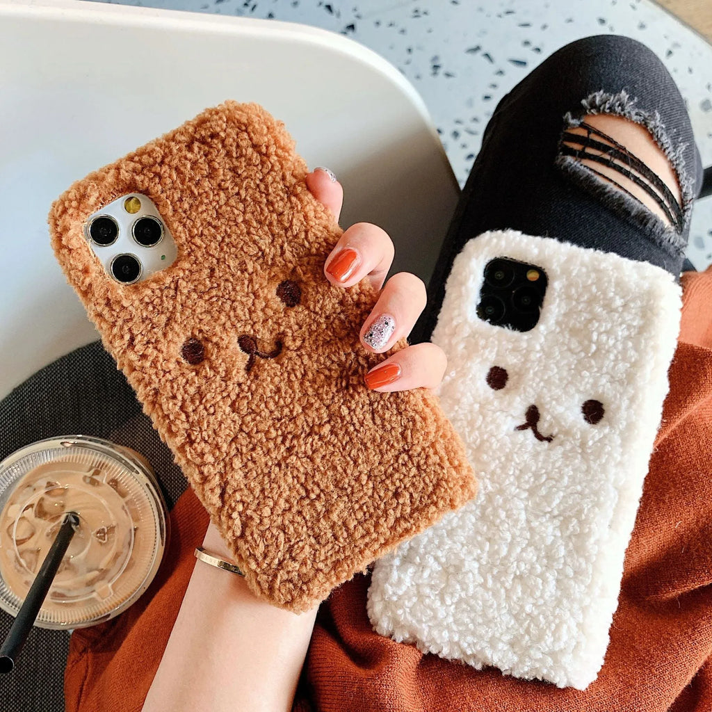 Brown TPU iPhone case with an embroidered plush cartoon bear face on the back.