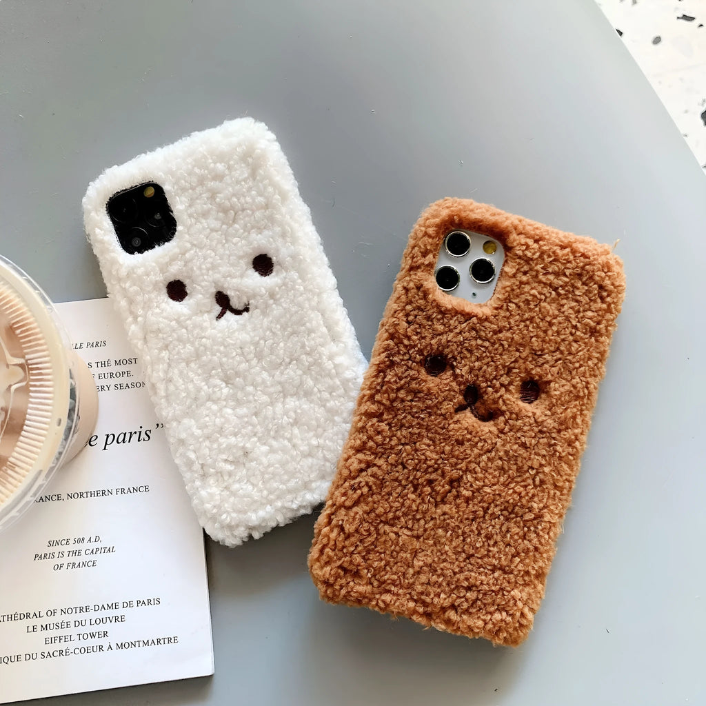 Brown TPU iPhone case with an embroidered plush cartoon bear face on the back.