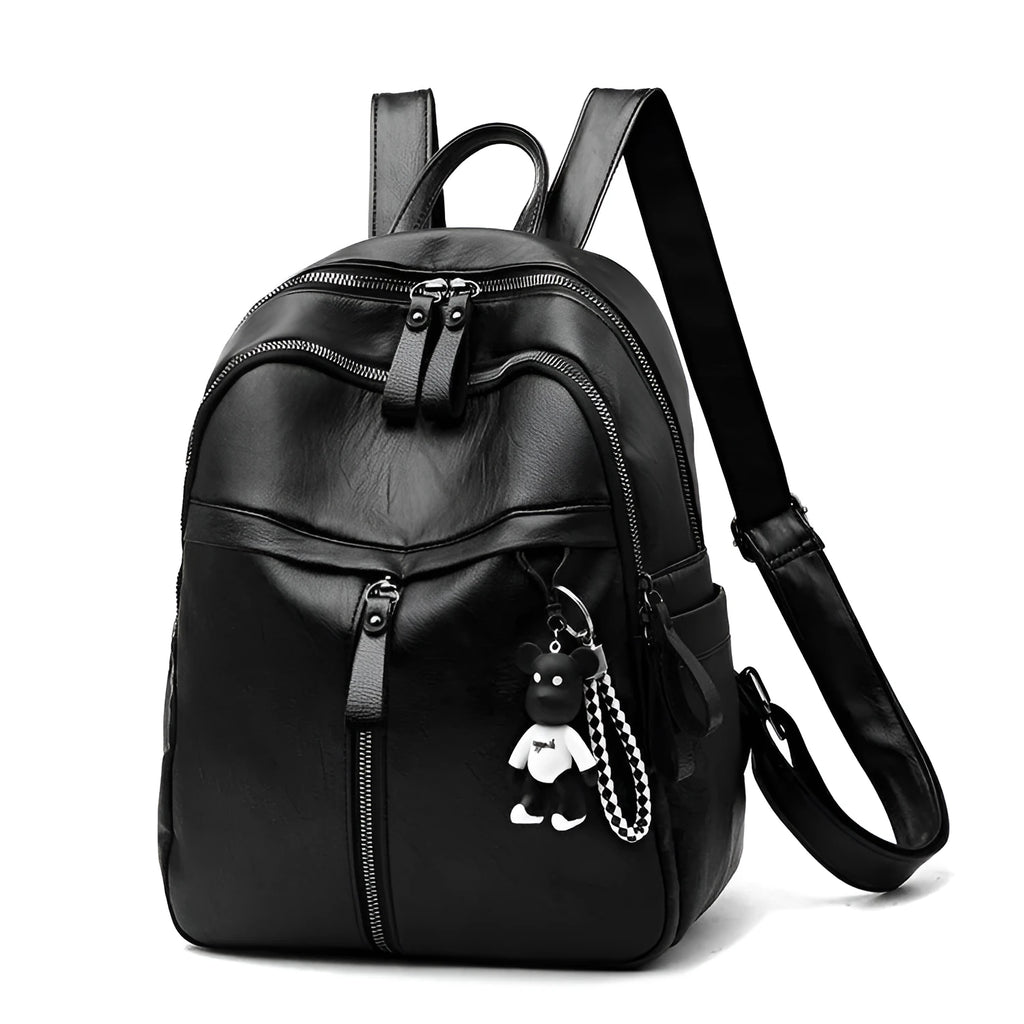 Black Pu leather soft surface backpack with double straps and a zippered opening.