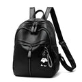Black Pu leather soft surface backpack with double straps and a zippered opening.