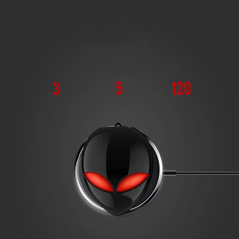 Creative Outer T8 Starman alien-design Bluetooth headset with red and blue lights in charging case.