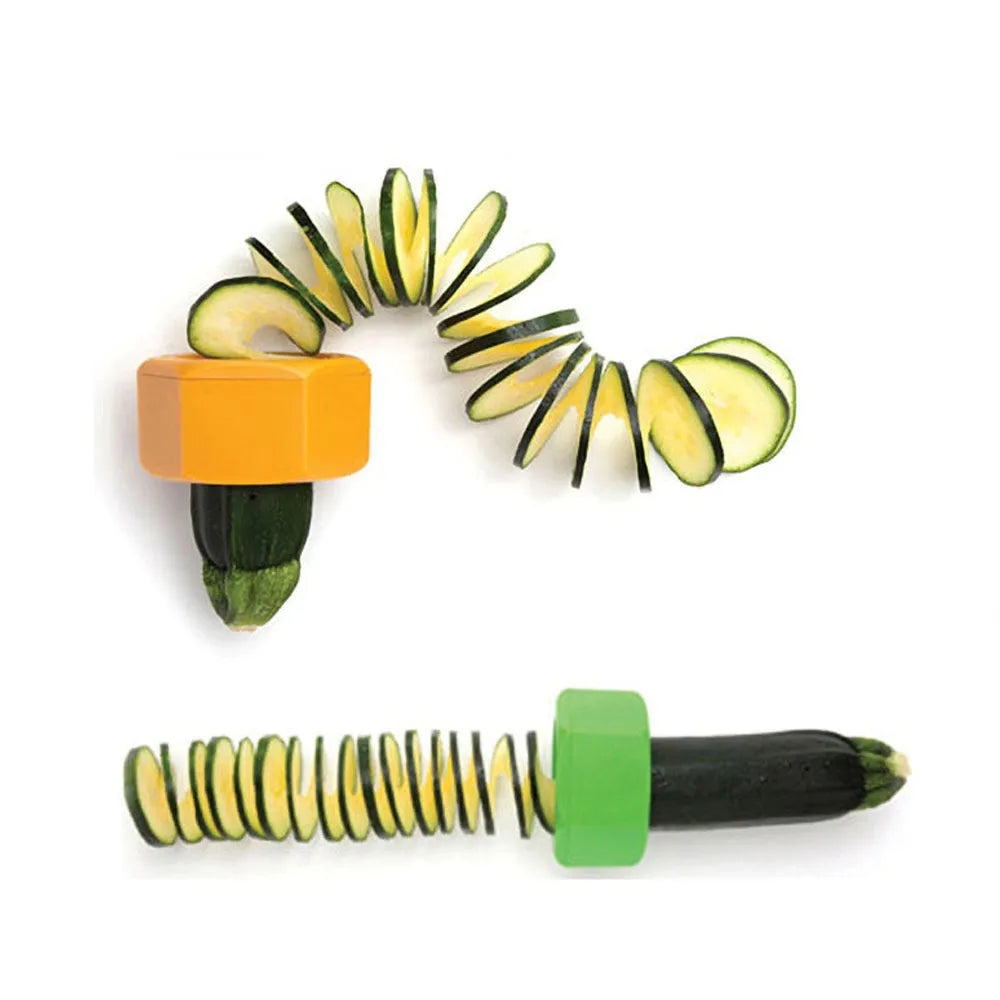 Yellow and green plastic spiral vegetable cutter for cucumbers on a kitchen counter.