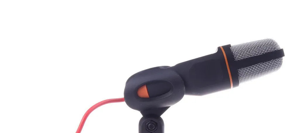 Black wired PC microphone with a detached desktop stand holder and a long cable.