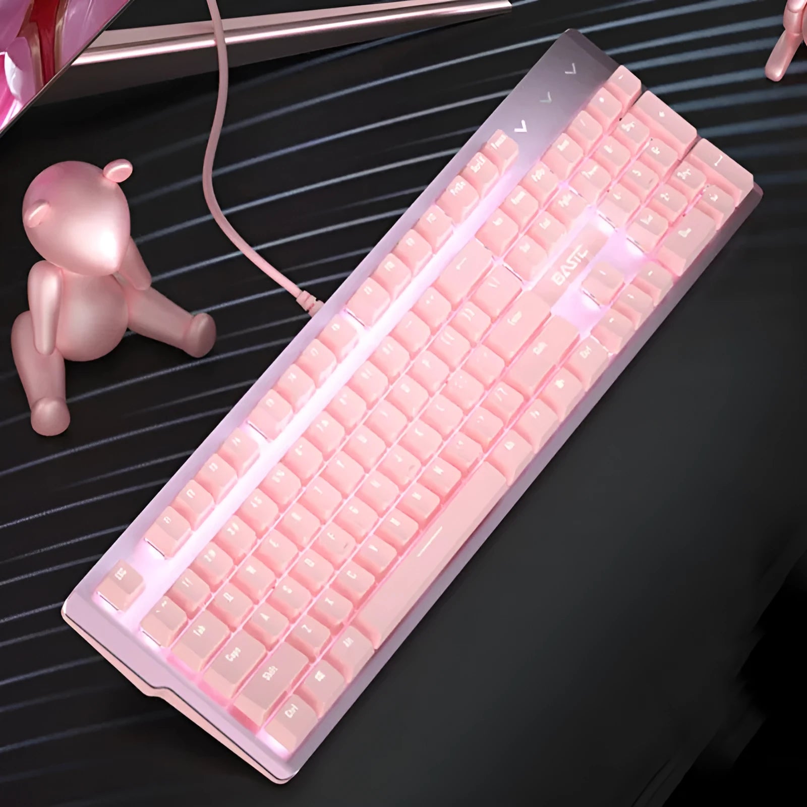Pink wired mechanical keyboard and matching mouse with green axis switches for gaming.