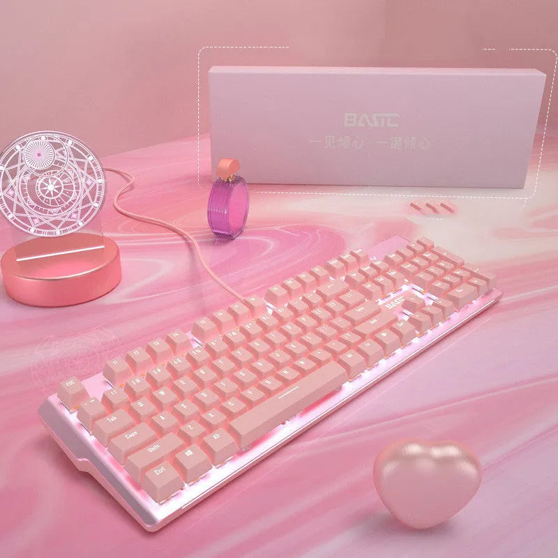 Pink wired mechanical keyboard and matching mouse with green axis switches for gaming.