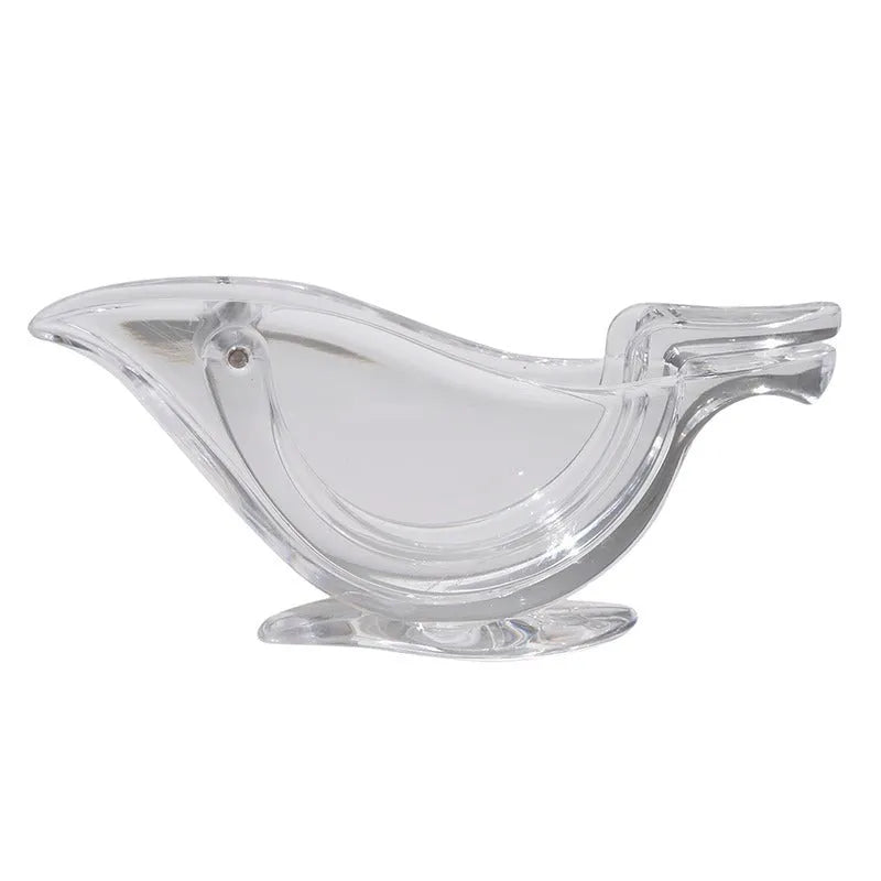 Transparent acrylic manual lemon juicer with bird-shaped design on a kitchen counter