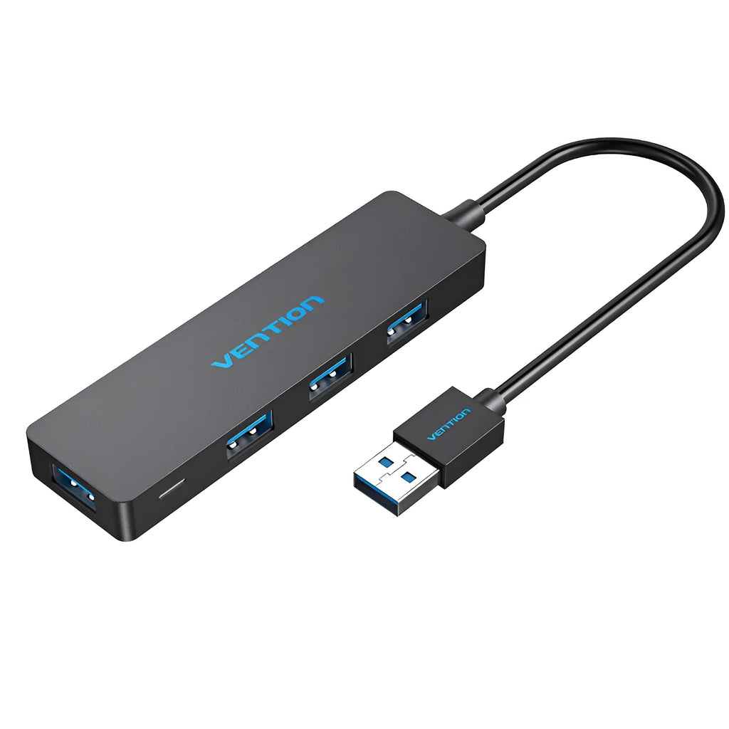 Black four-port USB 3.0 hub with a short 15cm cable on a desk.