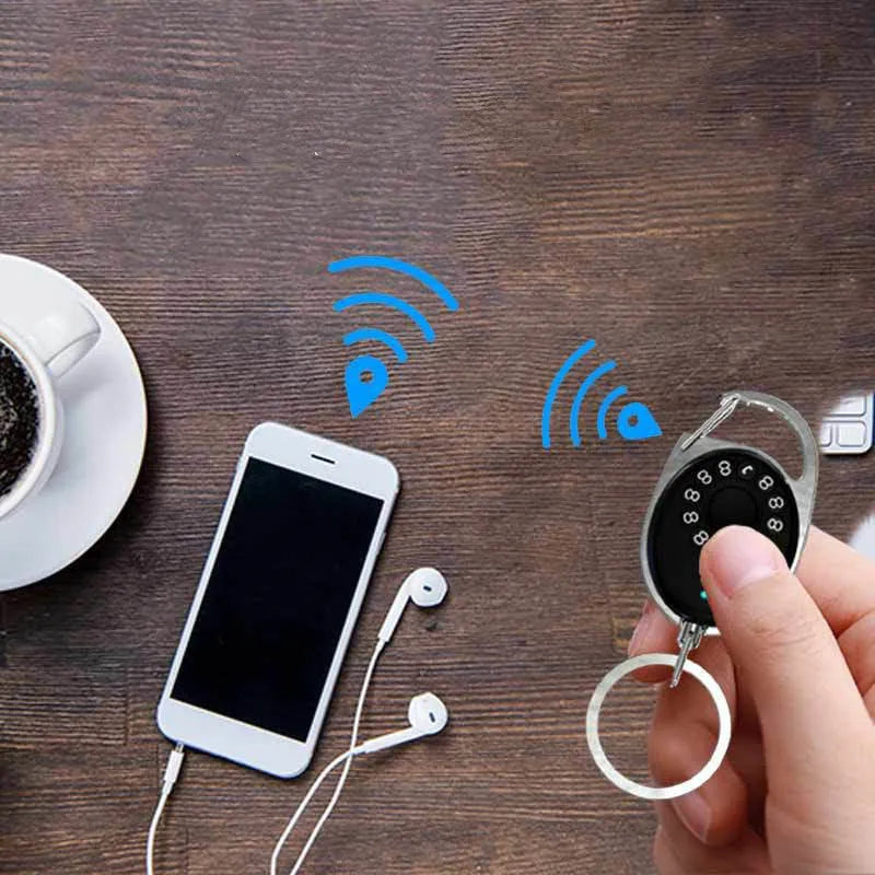 Black Bluetooth anti-lost tracker with keychain attachment compatible with Apple devices