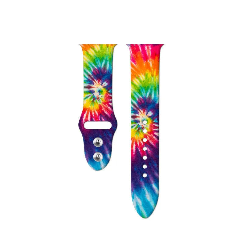 Colourful tie-dye patterned silicone strap for Apple Watch with adjustable buckle.