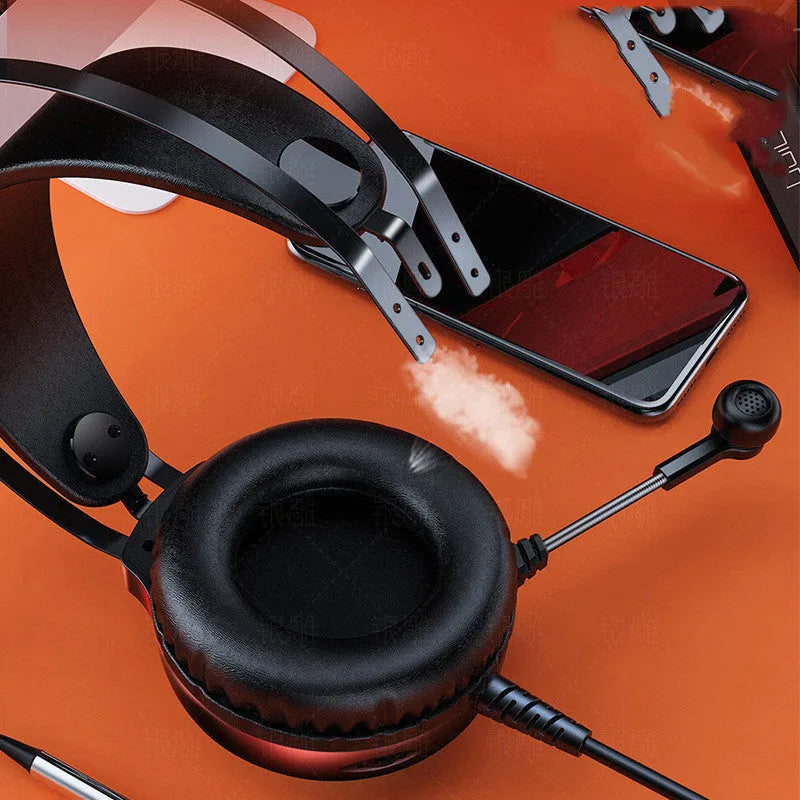 Black wired PC headset with microphone, over-ear protein earmuffs, and a long cable with a 3.5mm straight plug.