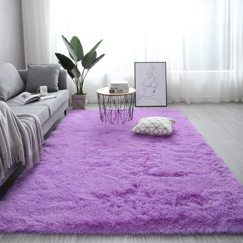 Large rectangle plush carpet in beige with anti-slip backing on wooden flooring
