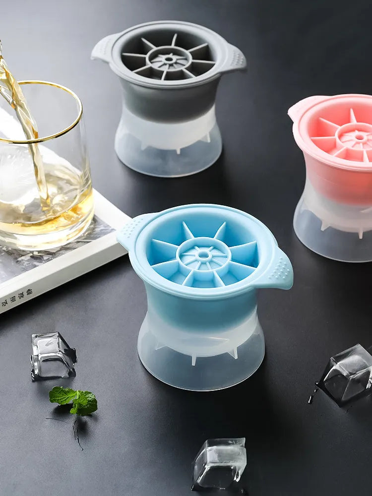 Silicone ice tray showing hockey puck, round, and pentagon shaped moulds in various colours