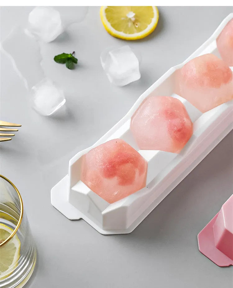 Silicone ice tray showing hockey puck, round, and pentagon shaped moulds in various colours