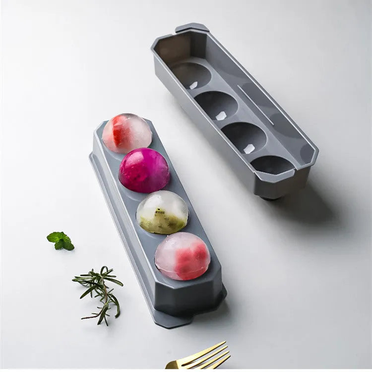 Silicone ice tray showing hockey puck, round, and pentagon shaped moulds in various colours