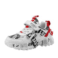 Blue and white boys sports sneakers with velcro strap closure and rubber sole