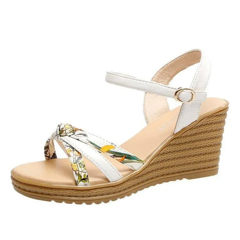 Pink women's wedge heel sandals with a fish mouth toe and buckle strap on a non-slip sole.