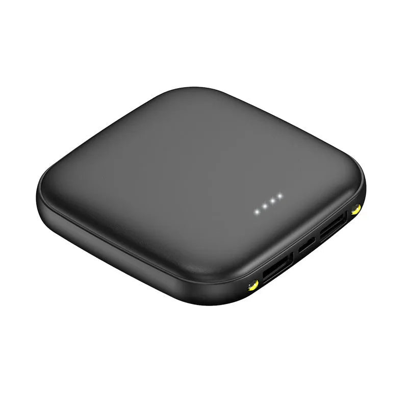 Compact black 20000mAh power bank with LED flashlight, showing scale next to a mobile phone.