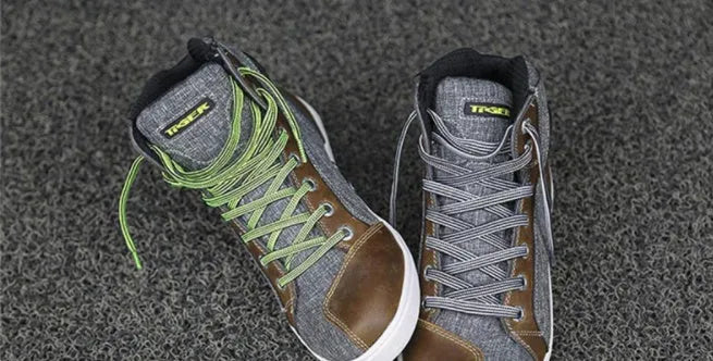 Black and grey casual short boots for motorcycle riding with breathable and anti-fall features.