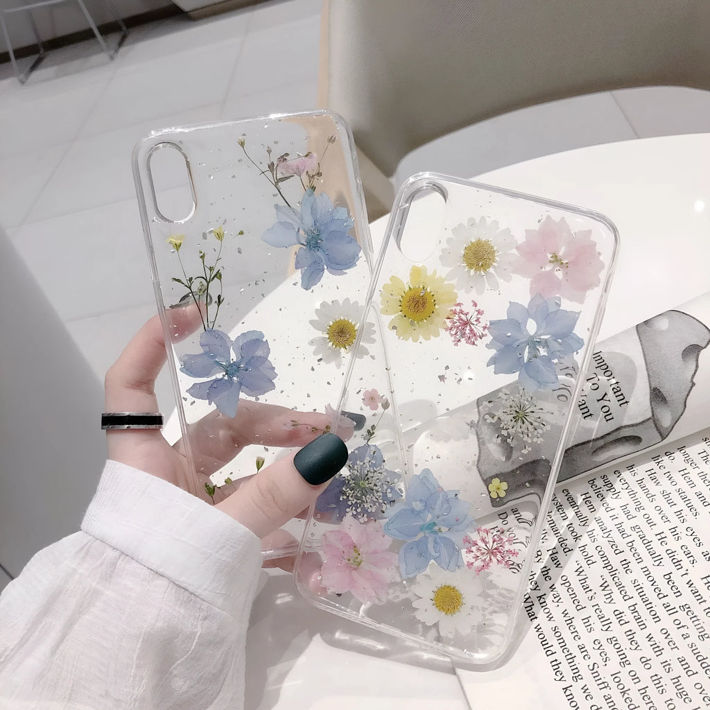 Transparent TPU phone case with real dried daisy flowers and gold glitter under clear epoxy coating