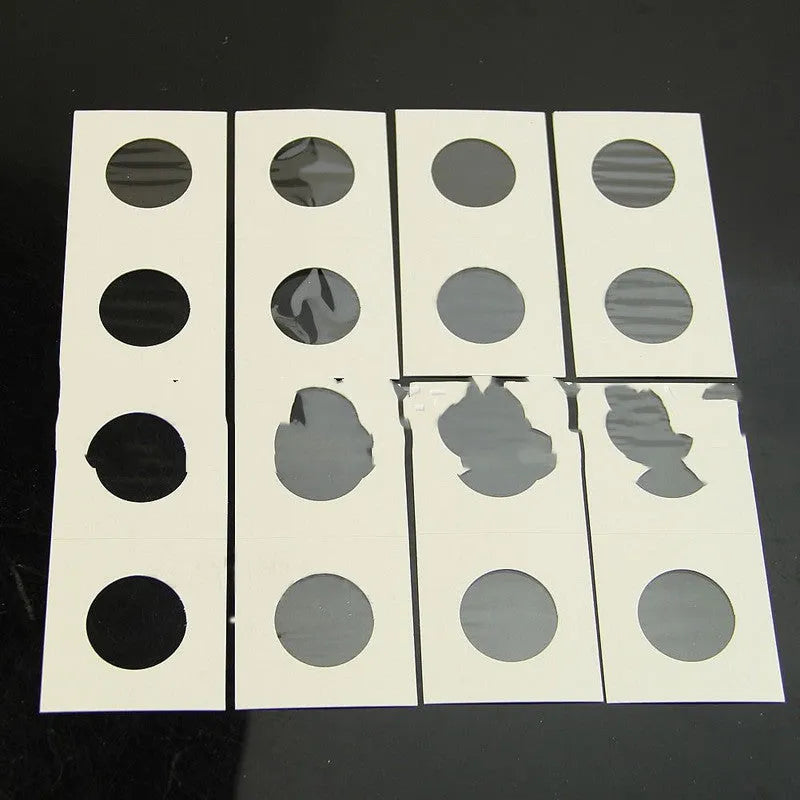 Set of 50 white paper coin protectors in transparent OPP bag for commemorative coin collection