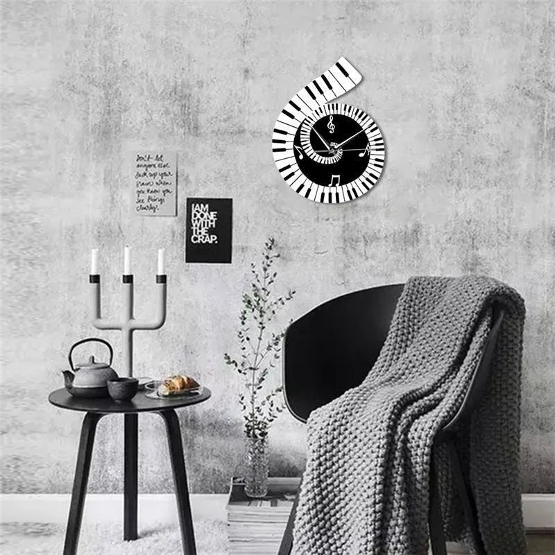 Black and white irregular shape wall clock decorated with treble clef symbol and piano keyboard graphic