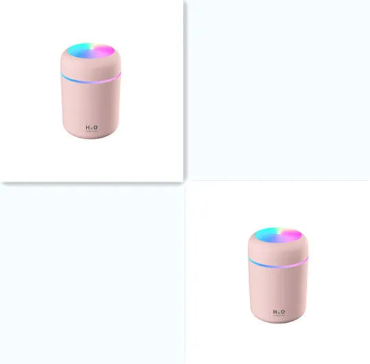 Pink car USB humidifier with LED lights showing water tank and control button