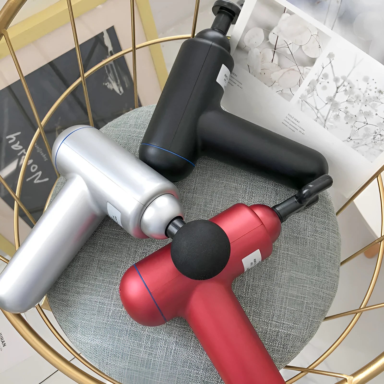 Fascia gun muscle massager in black, red, or white with USB charging port