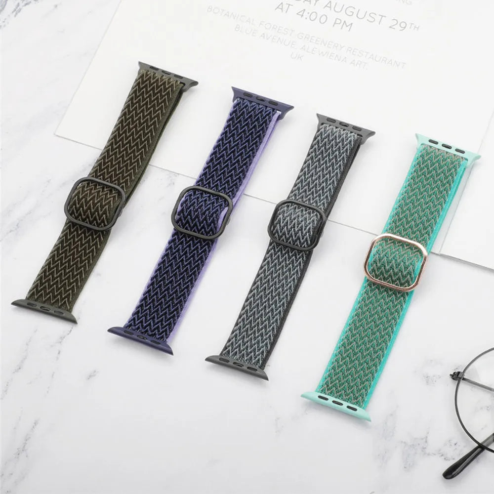 Braided nylon elastic Apple Watch strap with a grey wave pattern, shown detached from a watch.