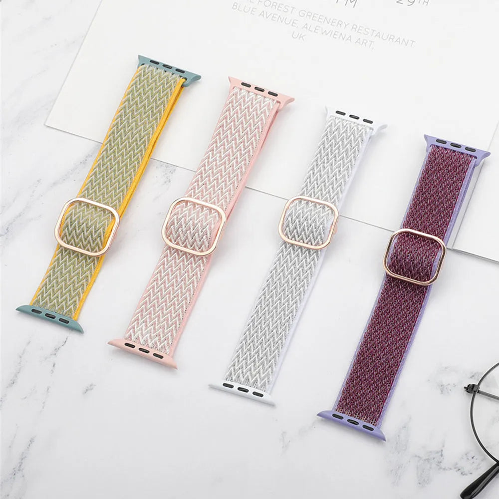 Braided nylon elastic Apple Watch strap with a grey wave pattern, shown detached from a watch.