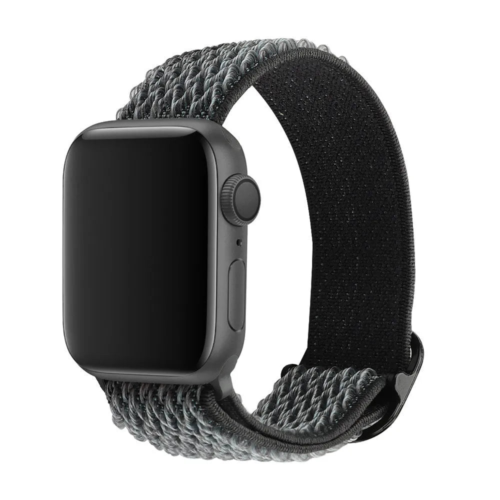Braided nylon elastic Apple Watch strap with a grey wave pattern, shown detached from a watch.