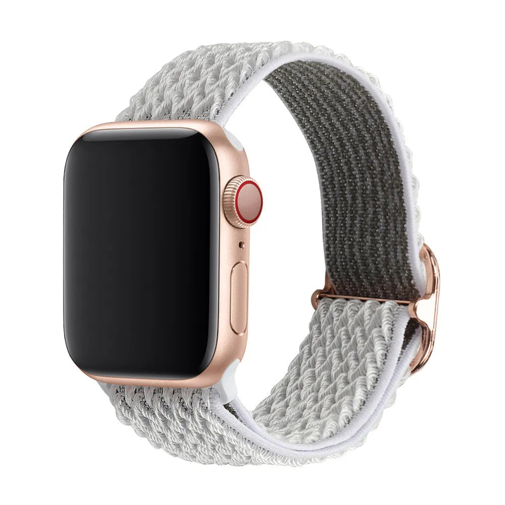 Braided nylon elastic Apple Watch strap with a grey wave pattern, shown detached from a watch.