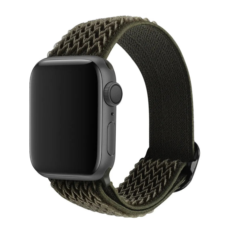 Braided nylon elastic Apple Watch strap with a grey wave pattern, shown detached from a watch.