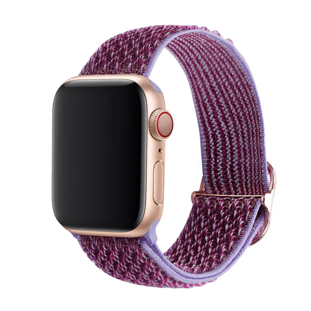 Braided nylon elastic Apple Watch strap with a grey wave pattern, shown detached from a watch.
