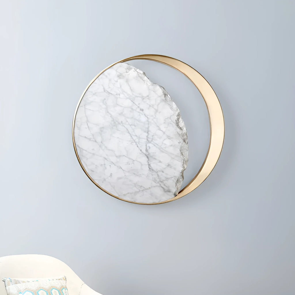 Circular marble and copper eclipse art design LED wall lamp mounted on a wall.