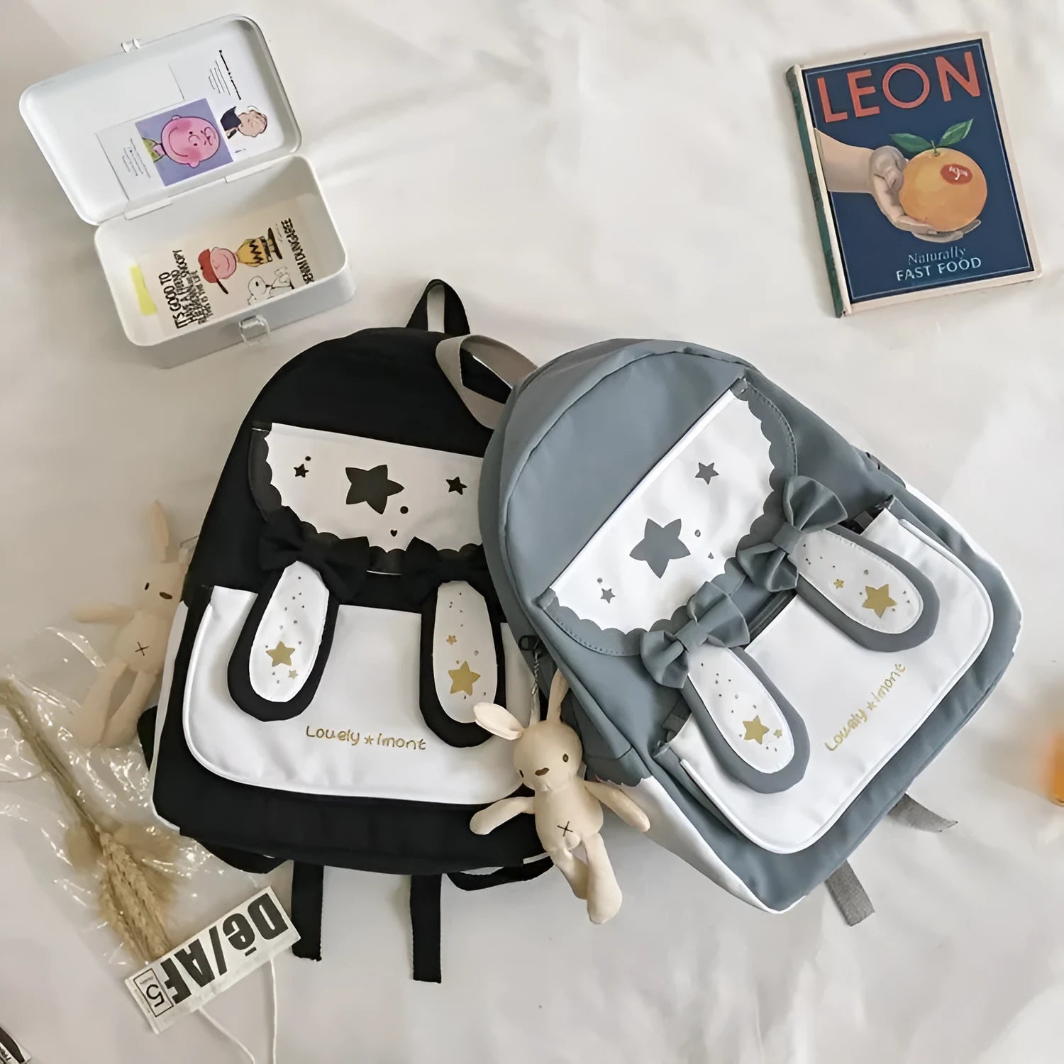 Cute bunny ears bowknot backpack in black with vertical square shape and soft handle