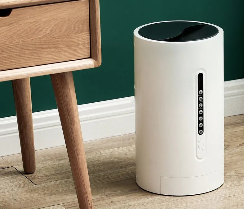 White smart pet feeder with digital timer and large food hopper on a counter.