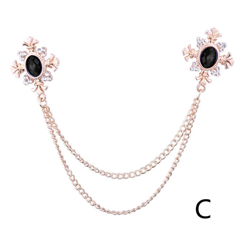 Fringed rhinestone cross collar pin in alloy with electroplated finish and inlaid rhinestones.