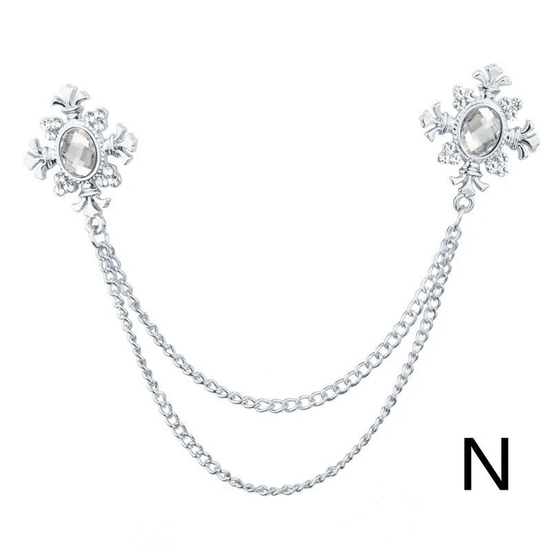 Fringed rhinestone cross collar pin in alloy with electroplated finish and inlaid rhinestones.