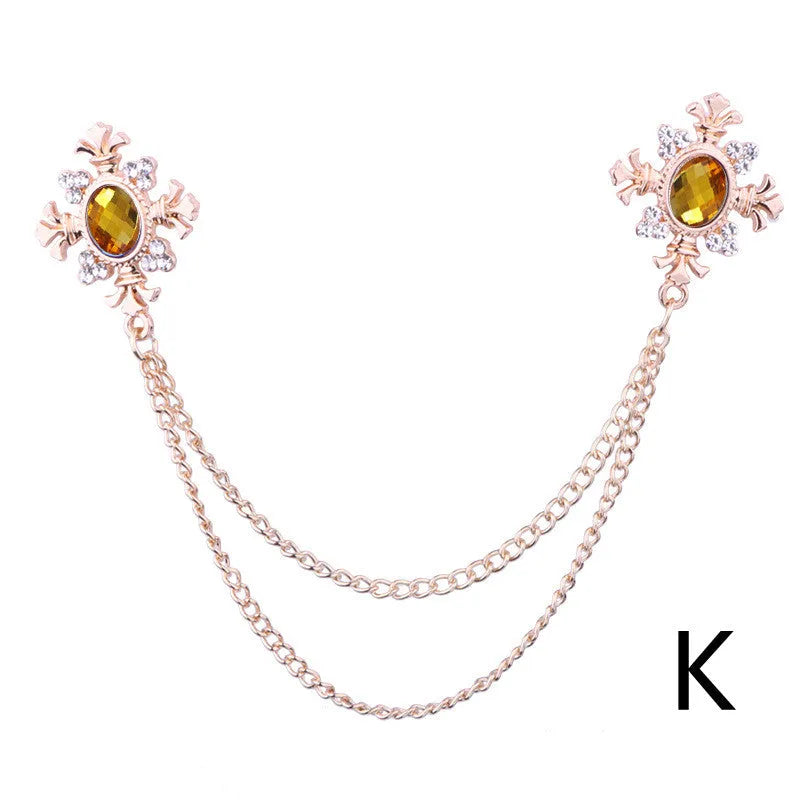 Fringed rhinestone cross collar pin in alloy with electroplated finish and inlaid rhinestones.