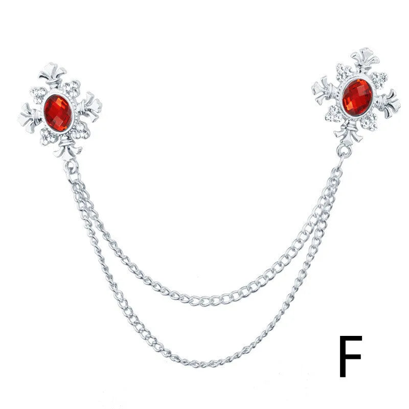 Fringed rhinestone cross collar pin in alloy with electroplated finish and inlaid rhinestones.