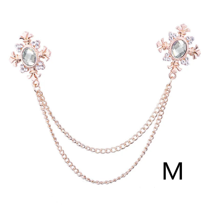 Fringed rhinestone cross collar pin in alloy with electroplated finish and inlaid rhinestones.