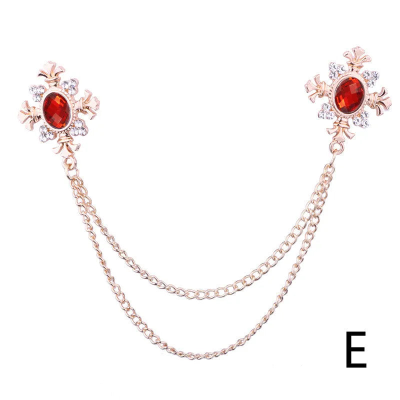 Fringed rhinestone cross collar pin in alloy with electroplated finish and inlaid rhinestones.