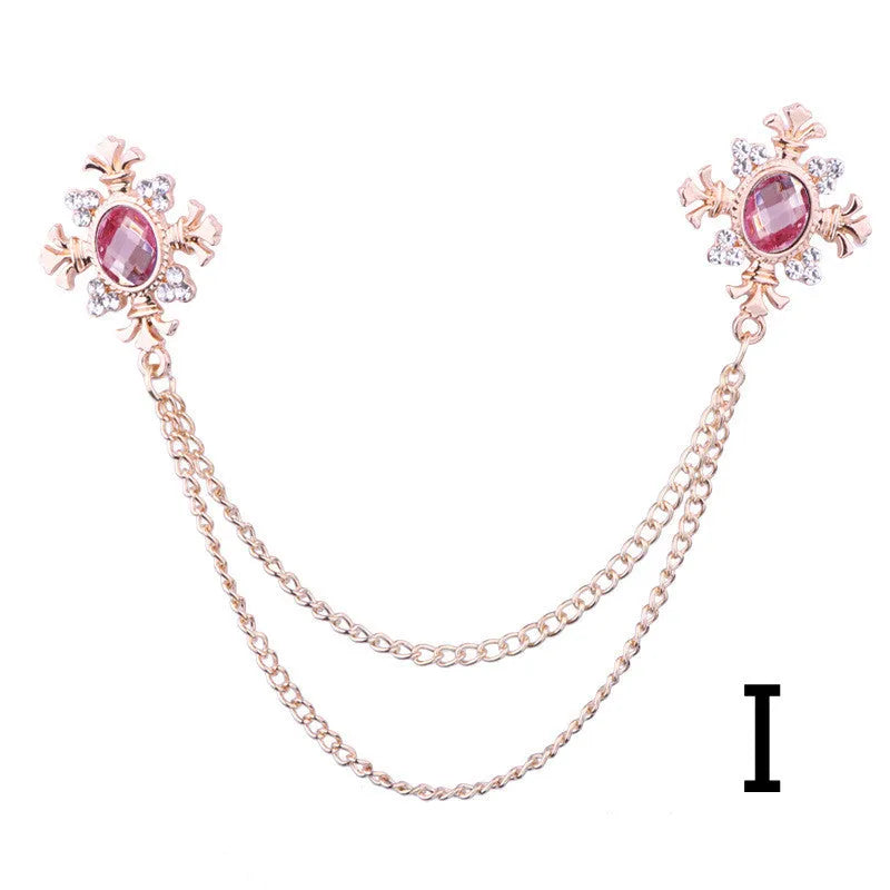 Fringed rhinestone cross collar pin in alloy with electroplated finish and inlaid rhinestones.