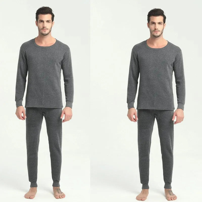 Men's round neck polyester thermal underwear suit in black with slim fit top and bottom on white background