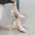 Women's apricot suede D'Orsay flat shoes with an ankle strap and low heel.