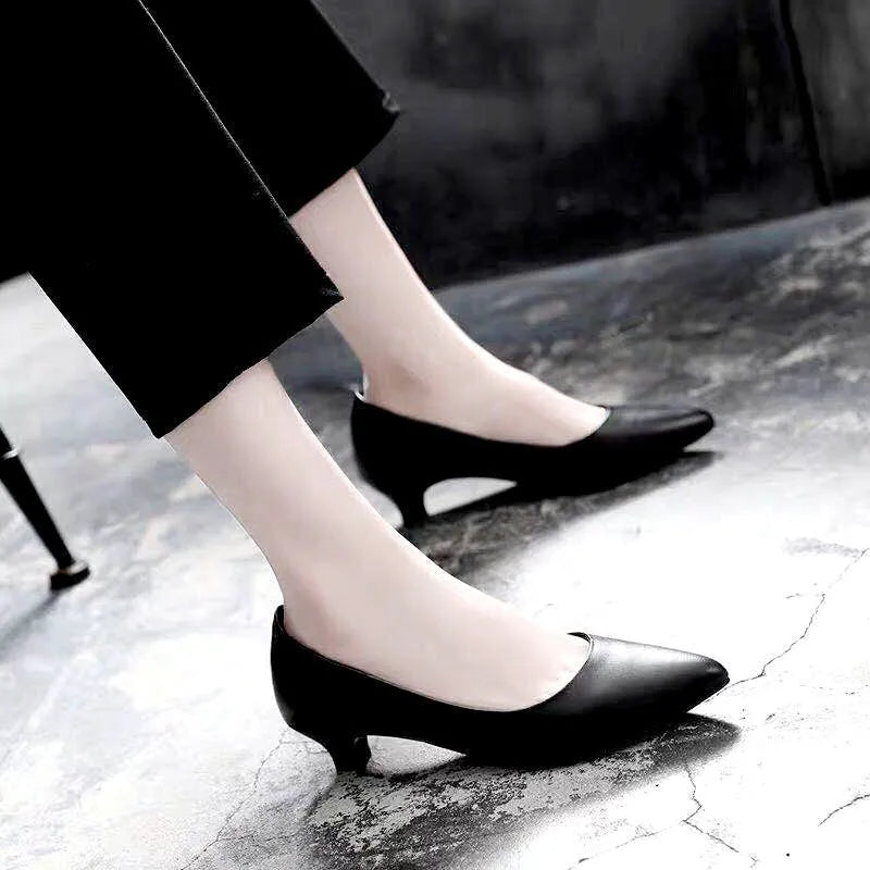 Women's silver and black stiletto wedding shoes with crystal detail on the heel.