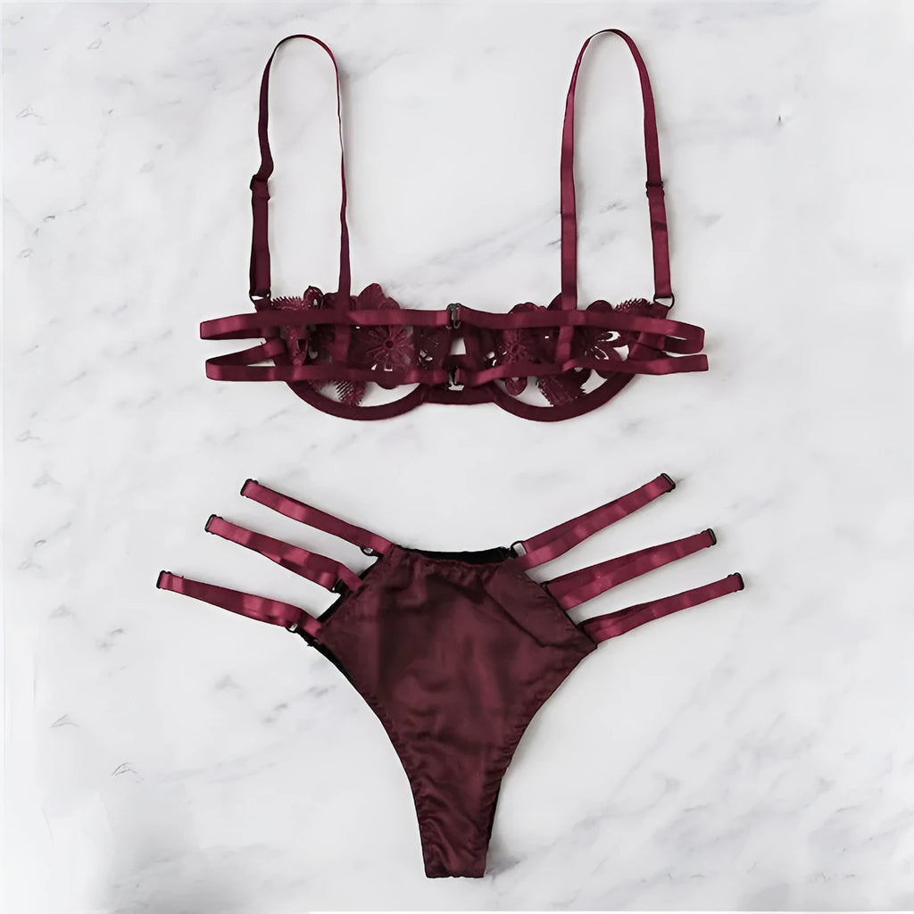 Women's black half cup unlined lingerie set with floral pattern and fitted straps