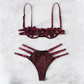 Women's black half cup unlined lingerie set with floral pattern and fitted straps