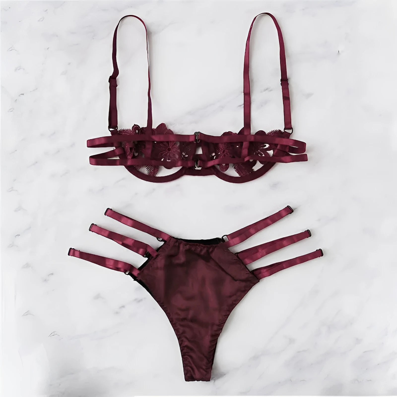 Women's black half cup unlined lingerie set with floral pattern and fitted straps